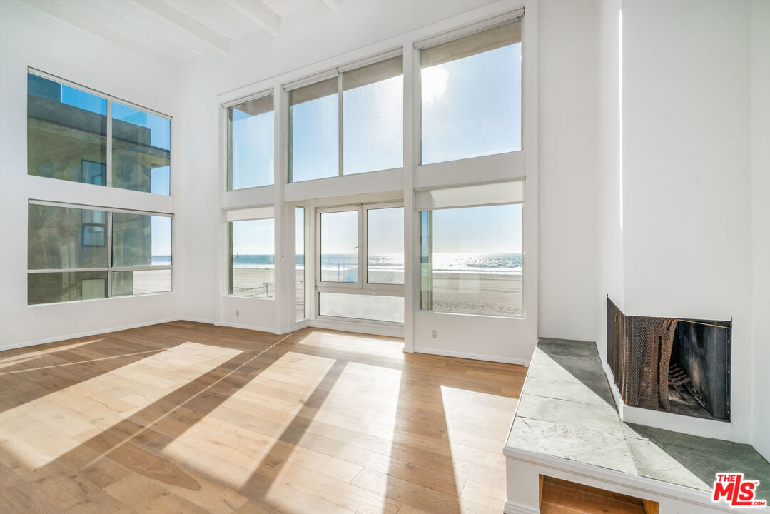 3711 Ocean Front Walk, Unit 3 Marina del Rey, CA 90292 - Photo 2 of 43 a view of an empty room with wooden floor and a window