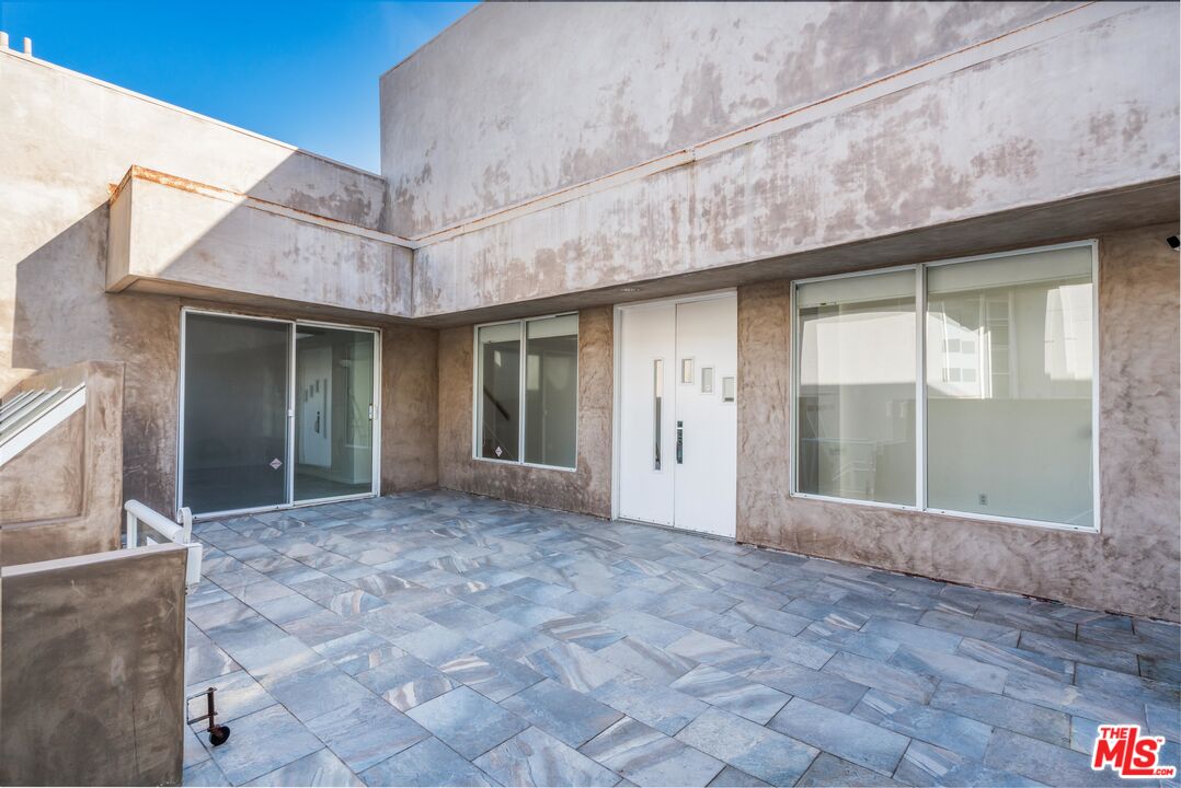 3711 Ocean Front Walk, Unit 3 Marina del Rey, CA 90292 - Photo 29 of 43 a view of a brick house with a large window