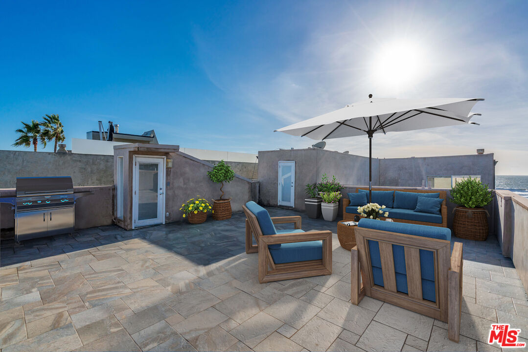 3711 Ocean Front Walk, Unit 3 Marina del Rey, CA 90292 - Photo 38 of 43 a view of a livingroom with furniture and a flat screen tv
