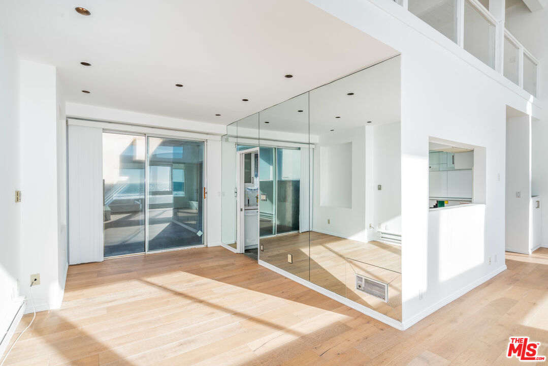 3711 Ocean Front Walk, Unit 3 Marina del Rey, CA 90292 - Photo 6 of 43 a view of a room with wooden floor and windows