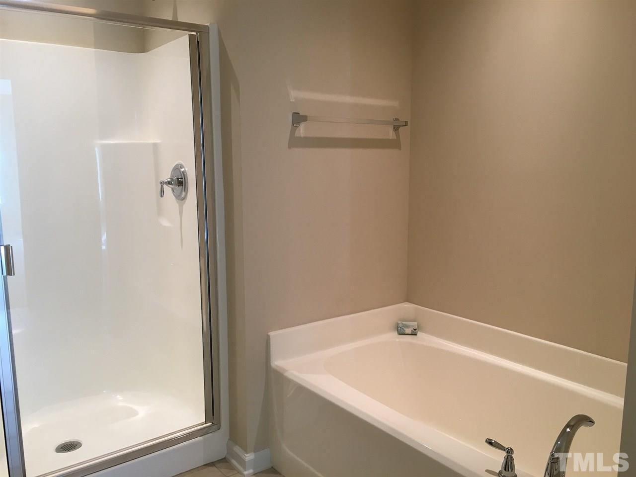 2423 Swans Rest Way Raleigh, NC 27606 - Photo 13 of 25 a bathroom with a tub