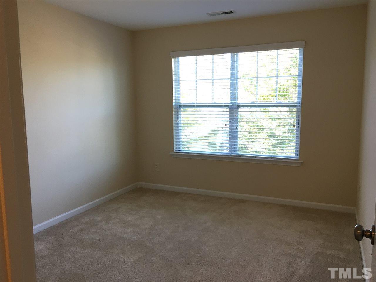 2423 Swans Rest Way Raleigh, NC 27606 - Photo 18 of 25 an empty room with a window