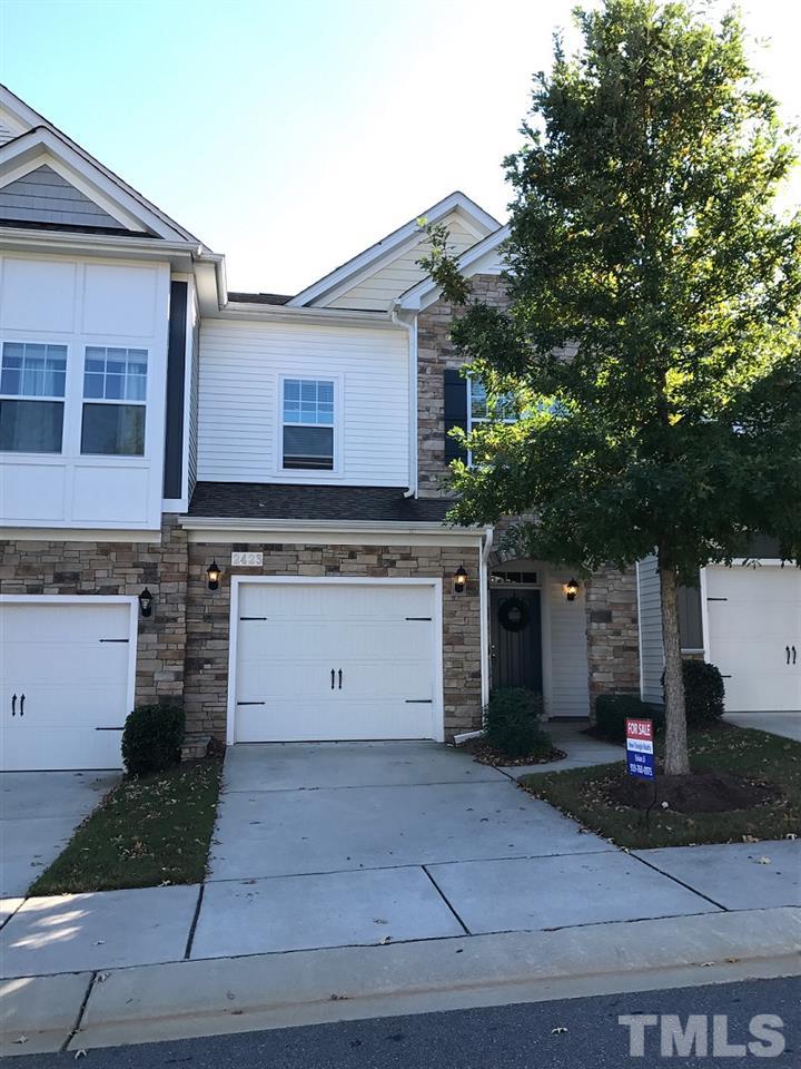 2423 Swans Rest Way Raleigh, NC 27606 - Photo 2 of 25 a view of a white house with a outdoor space