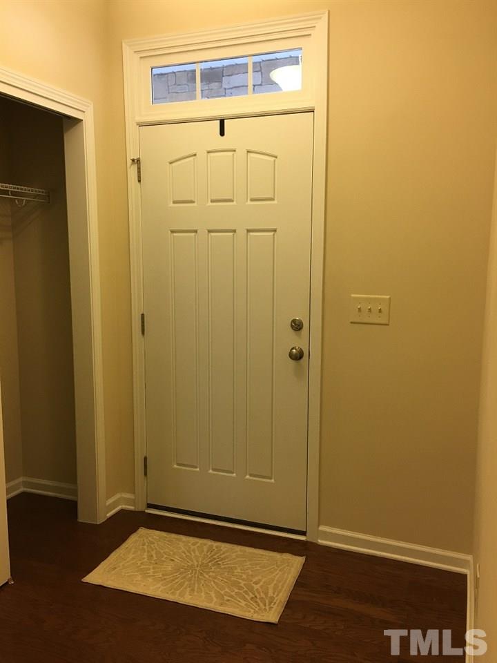 2423 Swans Rest Way Raleigh, NC 27606 - Photo 8 of 25 an empty room with wooden floor