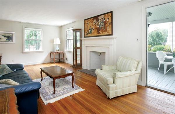 64 Longfellow Road Newton, MA 02462 - Photo 2 of 7 a living room with furniture and a fireplace