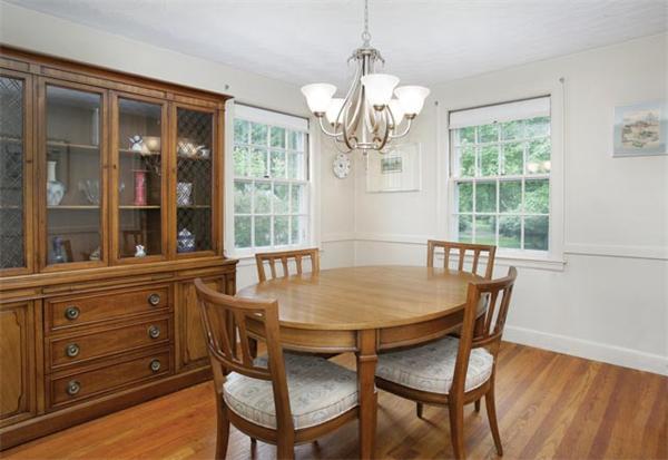 64 Longfellow Road Newton, MA 02462 - Photo 3 of 7 a view of a dining room with furniture a chandelier and wooden floor