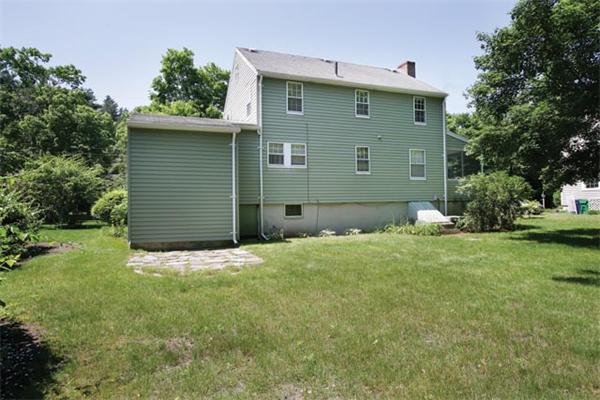64 Longfellow Road Newton, MA 02462 - Photo 6 of 7 a front view of a house with a garden