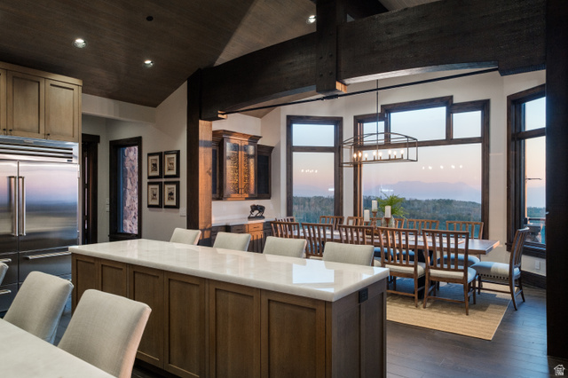 9156 Forest Road, Unit 24 Heber City, UT 84036 - Photo 12 of 42 Gourmet kitchen with an expansive island, stainless steel refrigerator, and wood-finish cabinetry
