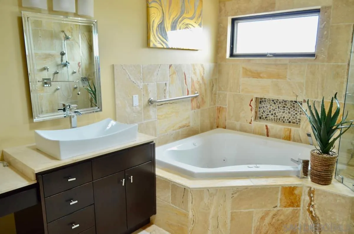 1235 Neptune Avenue Encinitas, CA 92024 - Photo 14 of 32 a bathroom with a sink and a bathtub