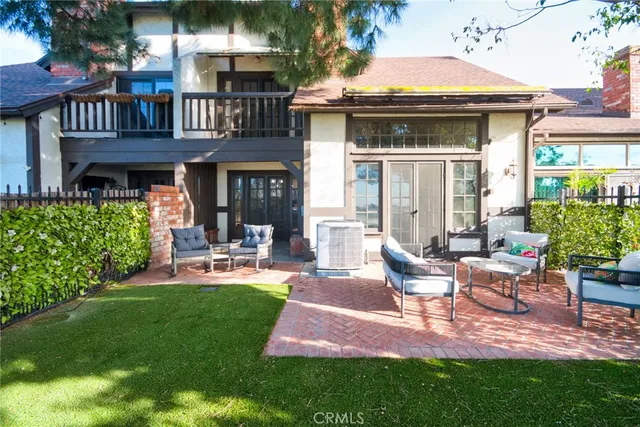 a view of an house with backyard porch and sitting area