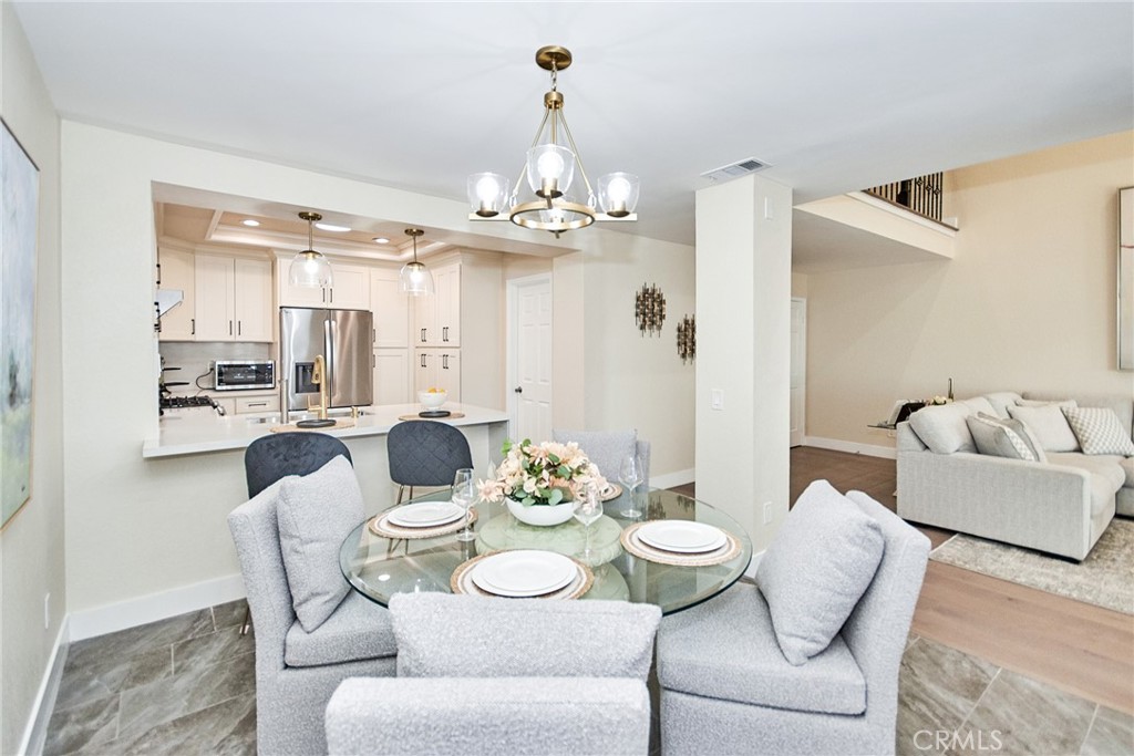950 South Rim Crest Drive Anaheim Hills, CA 92807 - Photo 13 of 40 a view of a dining room with furniture and wooden floor