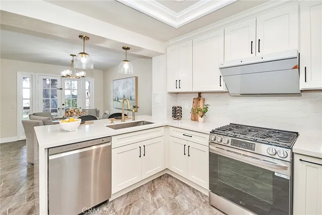 a kitchen with a sink stove and refrigerator