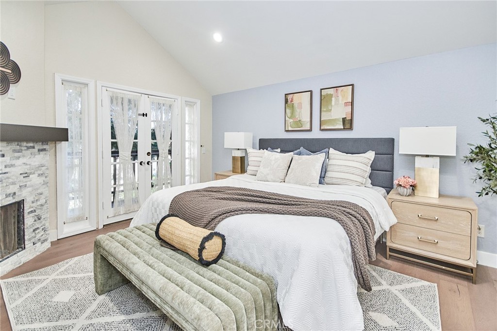 950 South Rim Crest Drive Anaheim Hills, CA 92807 - Photo 21 of 40 a bedroom with a bed and a couch