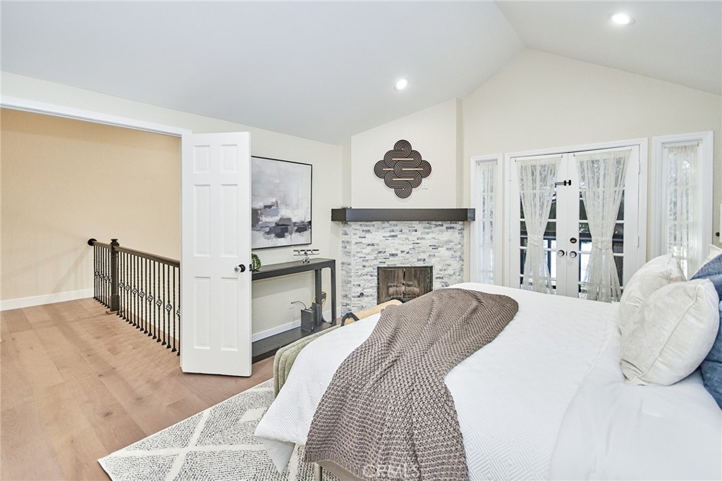 950 South Rim Crest Drive Anaheim Hills, CA 92807 - Photo 23 of 40 a bed room with a bed and a fireplace