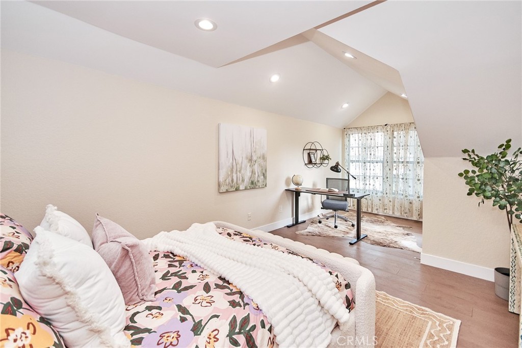 950 South Rim Crest Drive Anaheim Hills, CA 92807 - Photo 28 of 40 a bedroom with a bed and a table in it