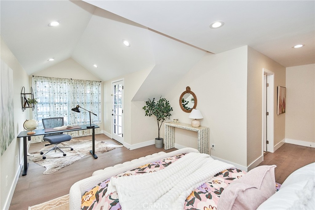 950 South Rim Crest Drive Anaheim Hills, CA 92807 - Photo 30 of 40 a bedroom with a bed and wooden floor