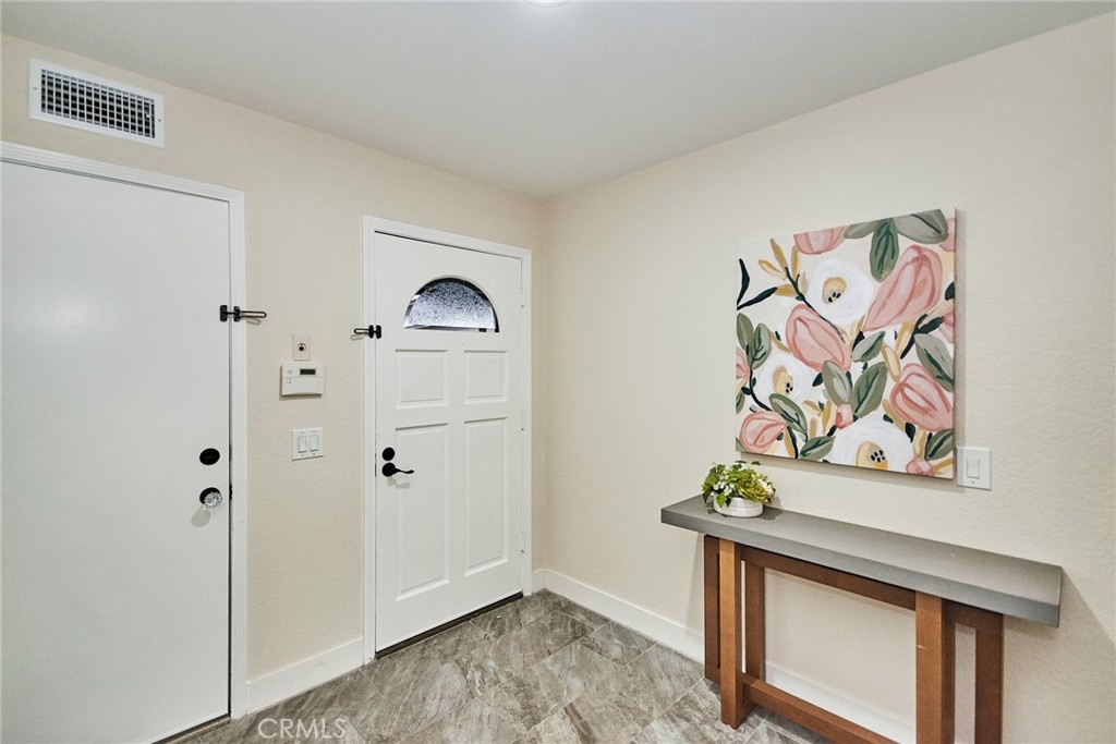 950 South Rim Crest Drive Anaheim Hills, CA 92807 - Photo 5 of 40 a view of an entryway with paintings on the wall