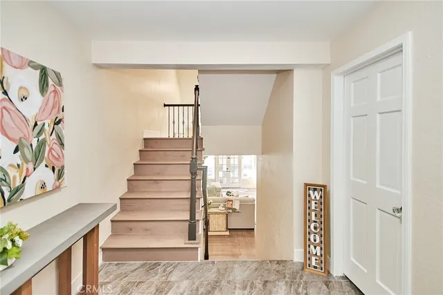 a living room with furniture a rug and a large window