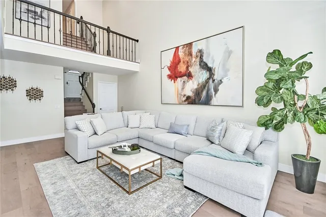 a dining room with furniture wooden floor and a chandelier
