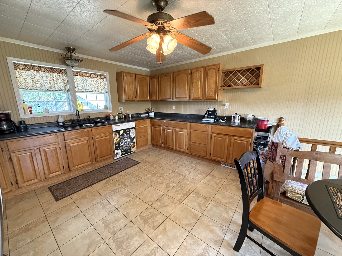 601 Ohio Street Grand Chain, IL 62941 - Photo 4 of 31 a kitchen with stainless steel appliances granite countertop a stove a sink dishwasher a dining table and chairs with wooden floor