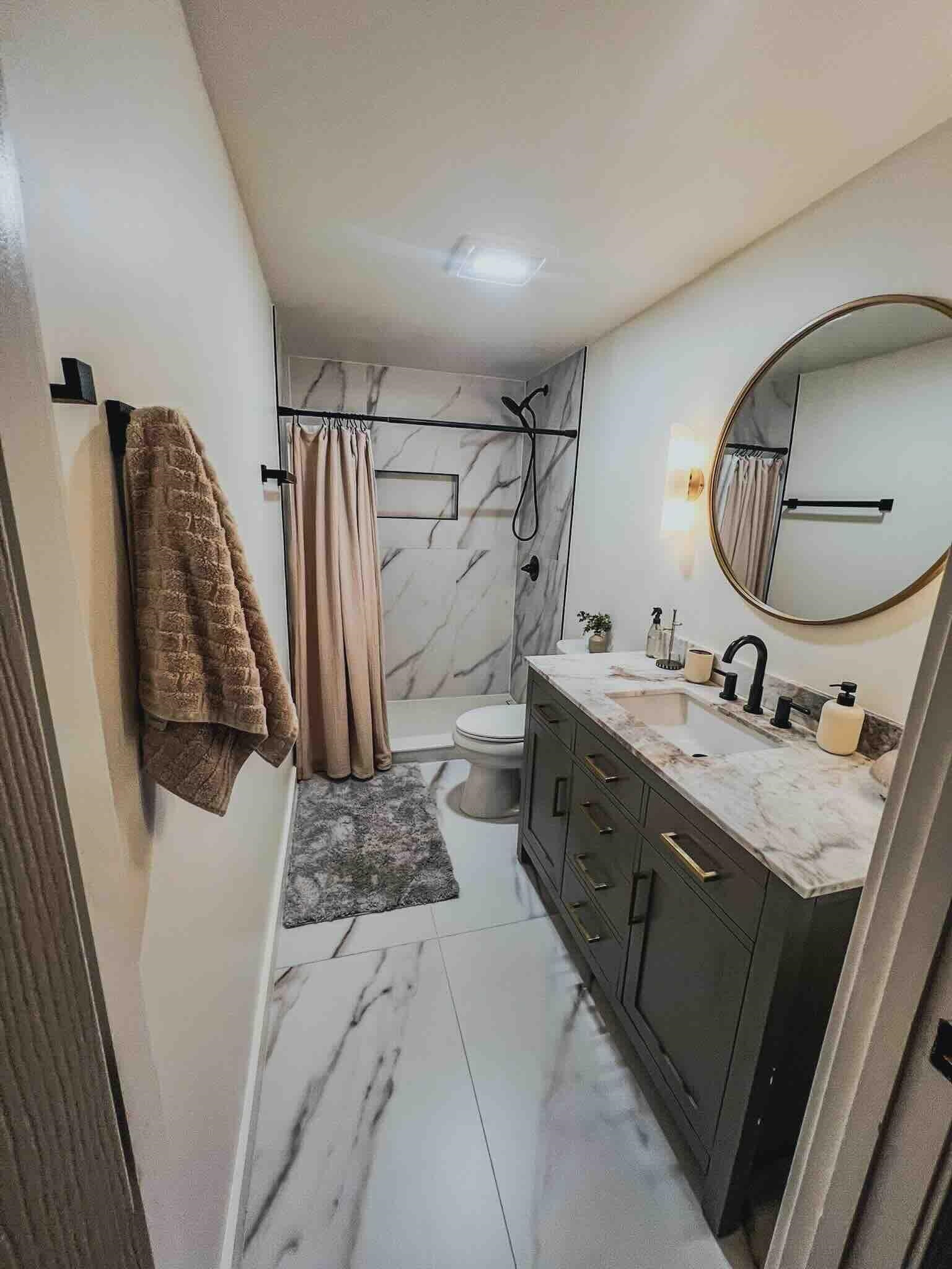 2578 Elmore Park Road Bartlett, TN 38134 - Photo 14 of 24 a bathroom with a double vanity sink and mirror