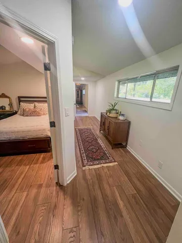 a bedroom with bed and window