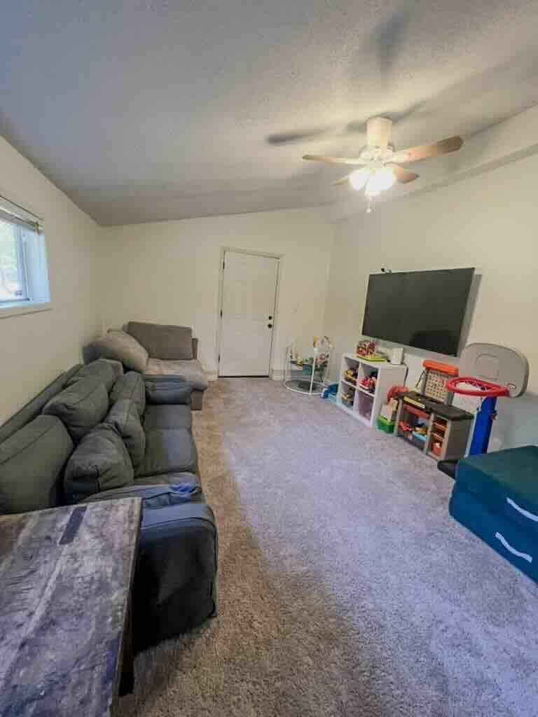 2578 Elmore Park Road Bartlett, TN 38134 - Photo 19 of 24 a living room with furniture and a flat screen tv