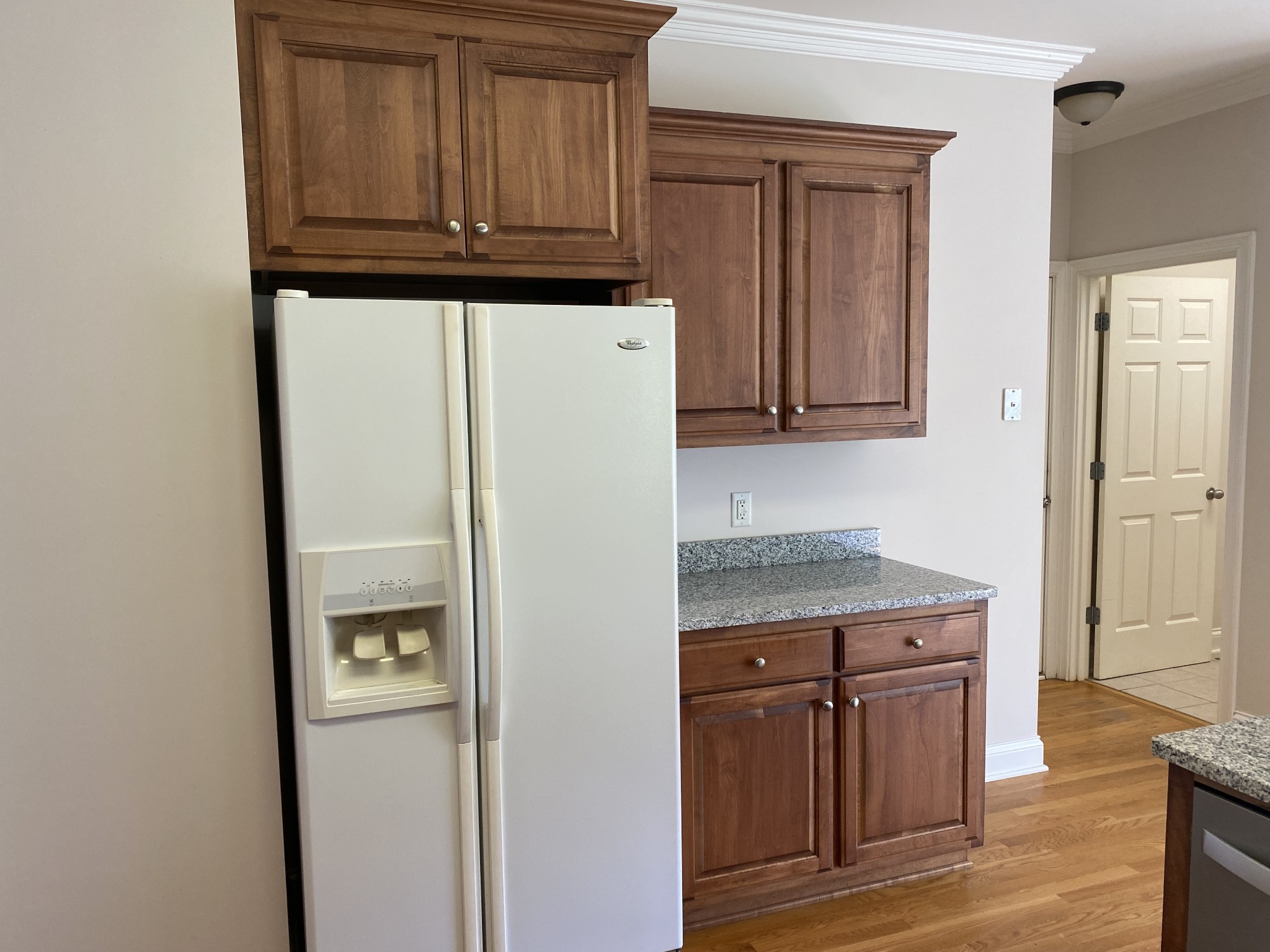 720 Heritage Road Lebanon, TN 37087 - Photo 12 of 31 a kitchen with granite countertop cabinets and refrigerator