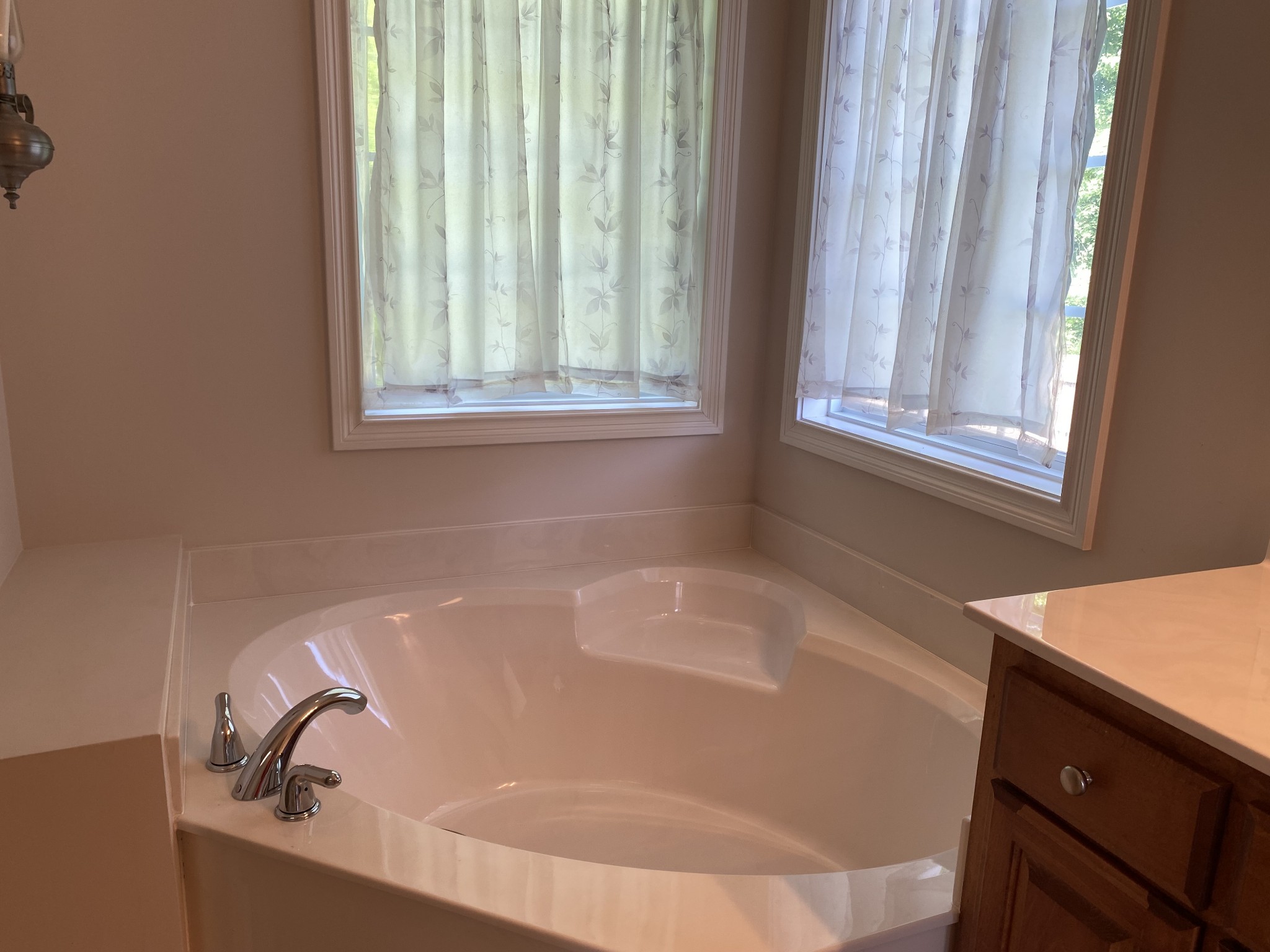 720 Heritage Road Lebanon, TN 37087 - Photo 19 of 31 a white bath tub sitting in a bathroom next to a window