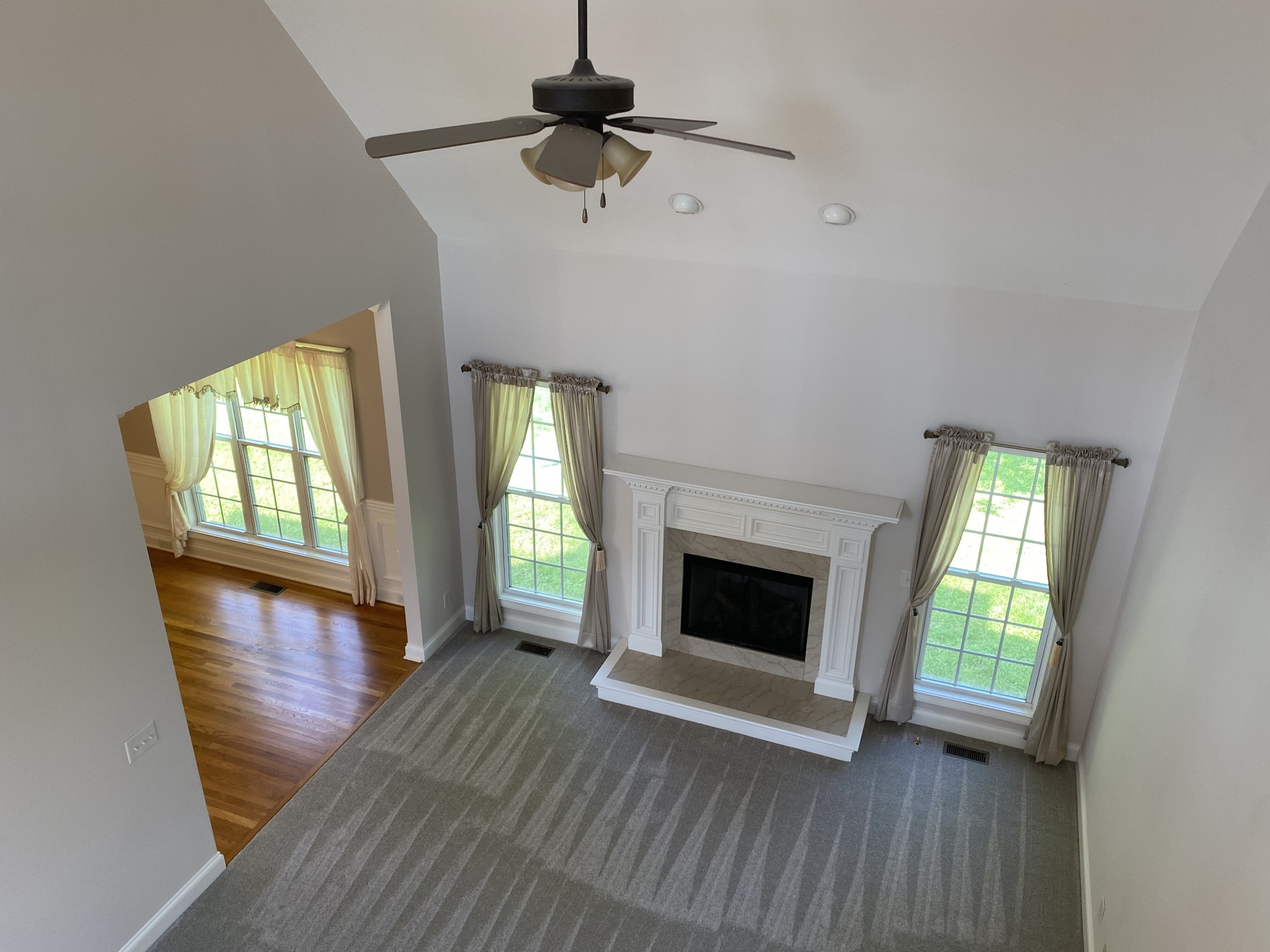 720 Heritage Road Lebanon, TN 37087 - Photo 23 of 31 a view of an empty room with wooden floor fireplace and a window