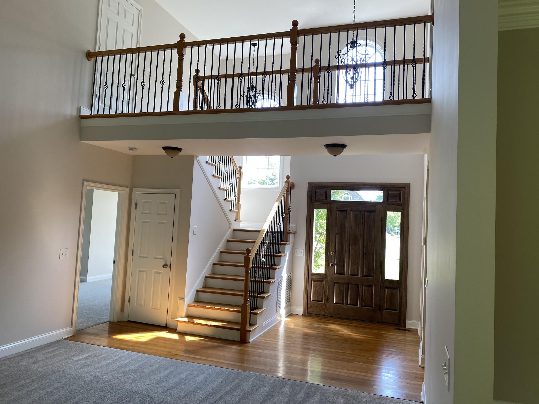 720 Heritage Road Lebanon, TN 37087 - Photo 4 of 31 a view of a hallway with wooden floor and staircase