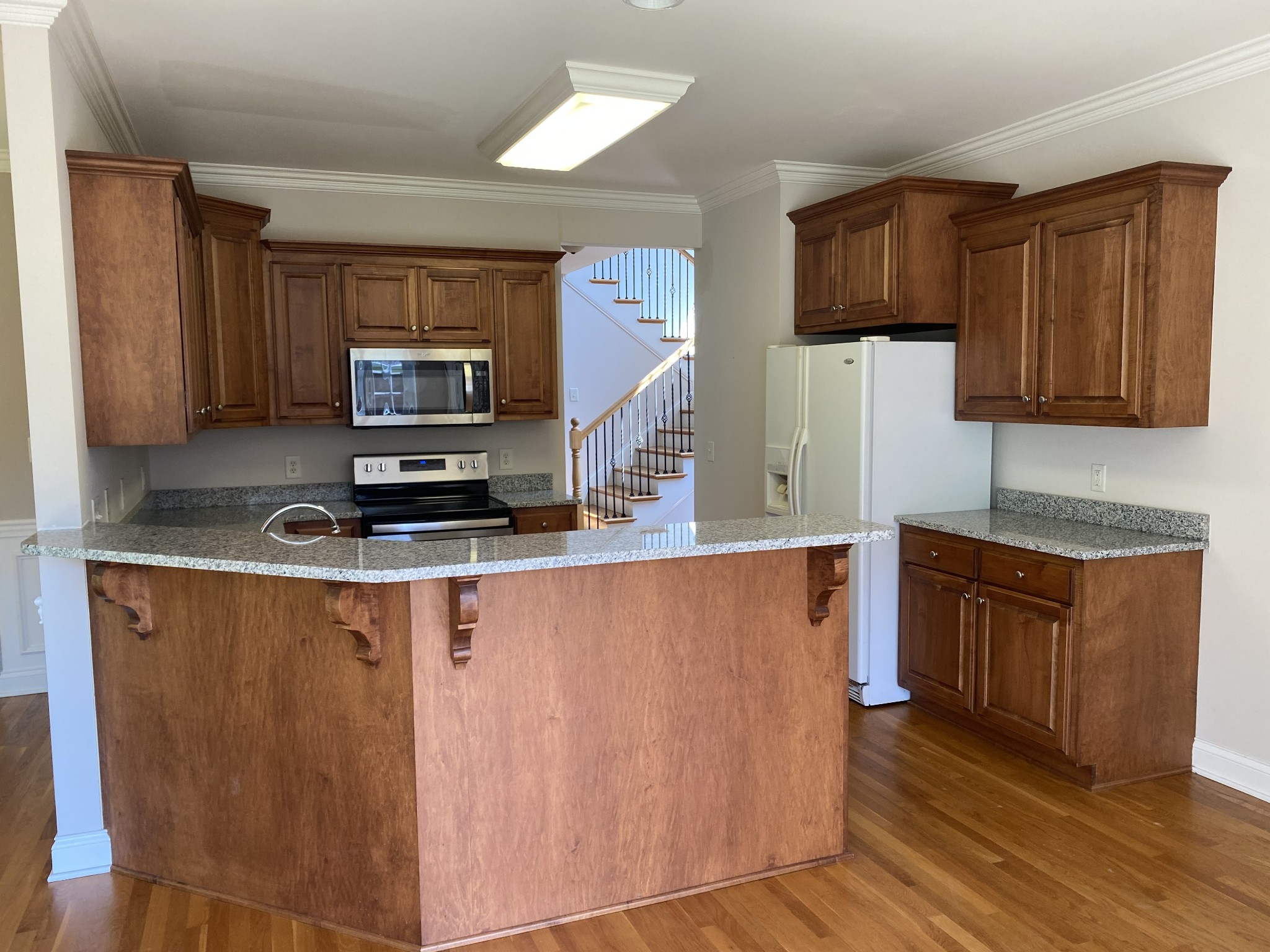 720 Heritage Road Lebanon, TN 37087 - Photo 9 of 31 a kitchen with stainless steel appliances granite countertop a refrigerator a stove top oven a sink and dishwasher