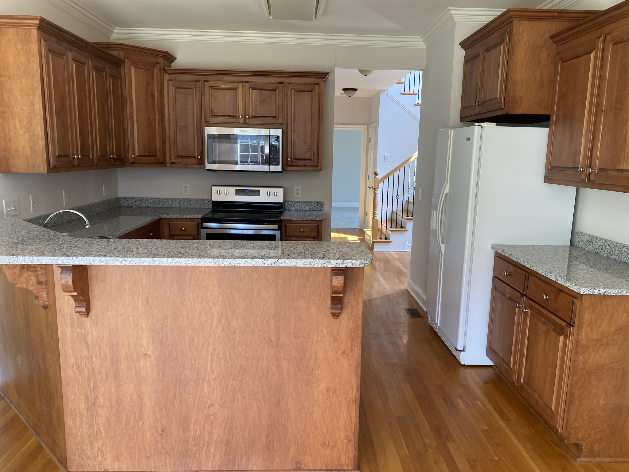 720 Heritage Road Lebanon, TN 37087 - Photo 10 of 31 a kitchen with stainless steel appliances granite countertop a refrigerator microwave and sink