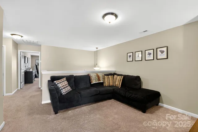 a living room with furniture and a couch