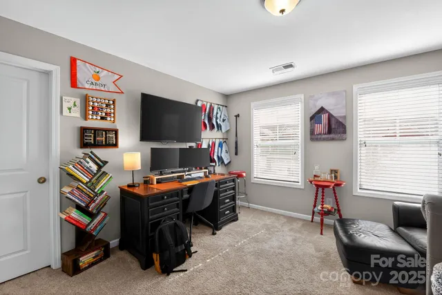 a bedroom with furniture and a window