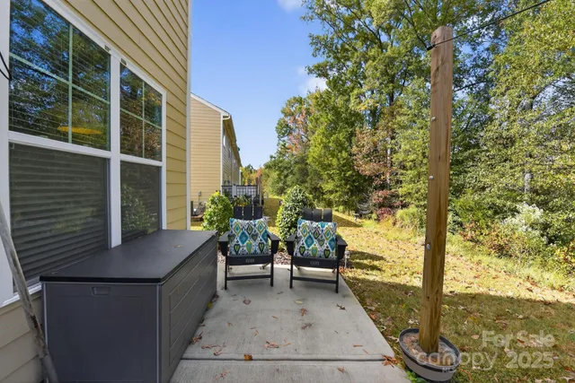 a view of two chairs in the balcony