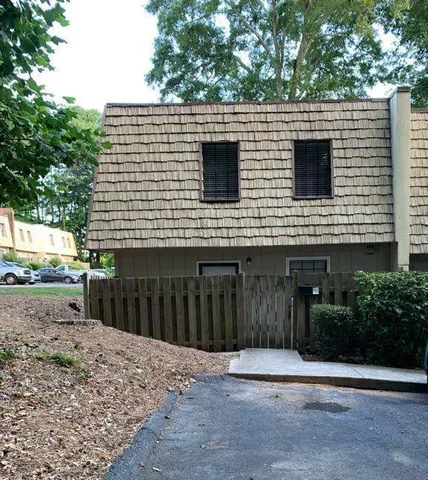 a view of a house with a backyard