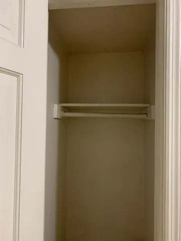 an empty room with wooden floor