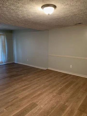a kitchen with white cabinets stainless steel appliances and sink