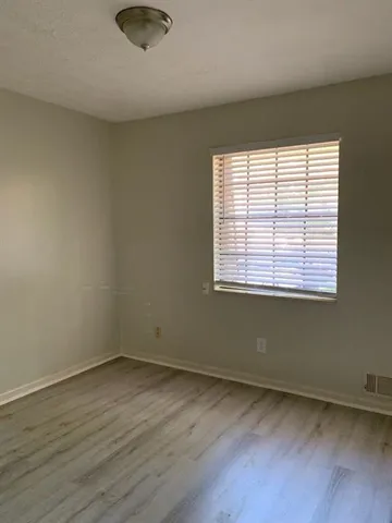 a bathroom with a shower and a sink