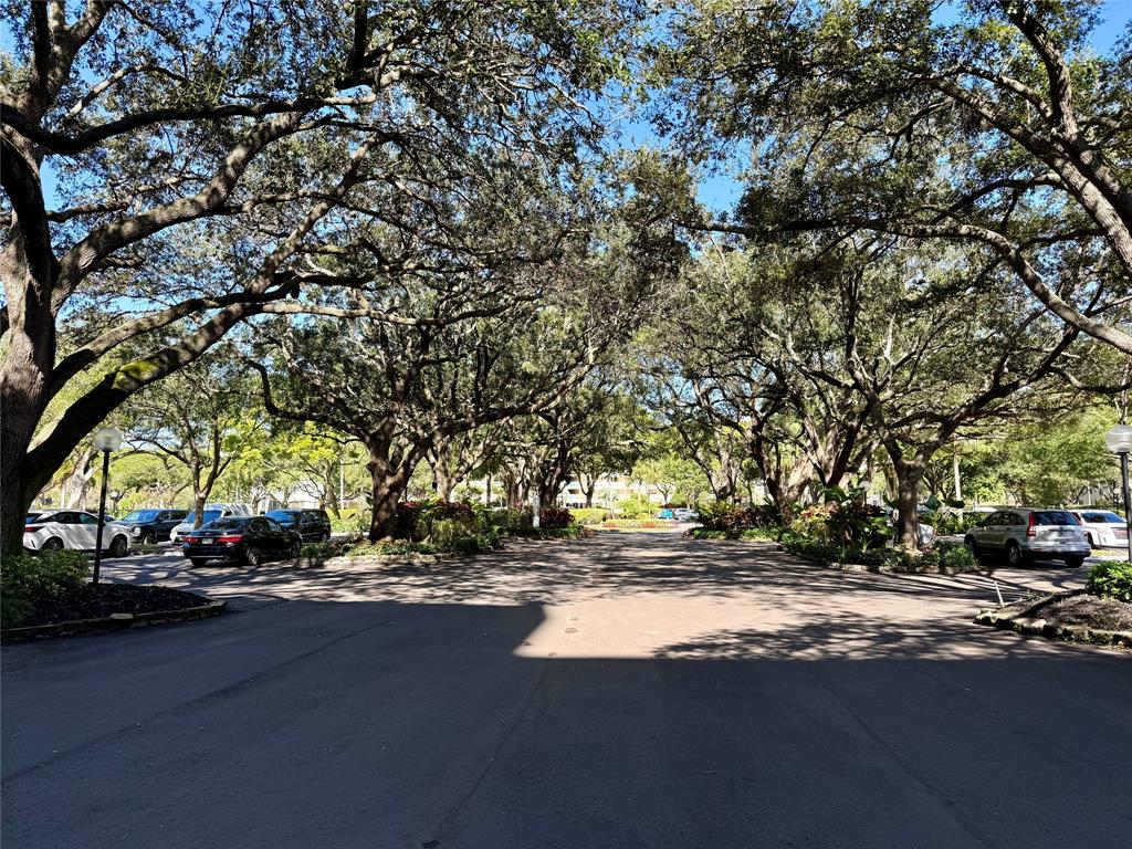 3520 Oaks Way, Unit 306 Pompano Beach, FL 33069 - Photo 18 of 18 a view of street with houses