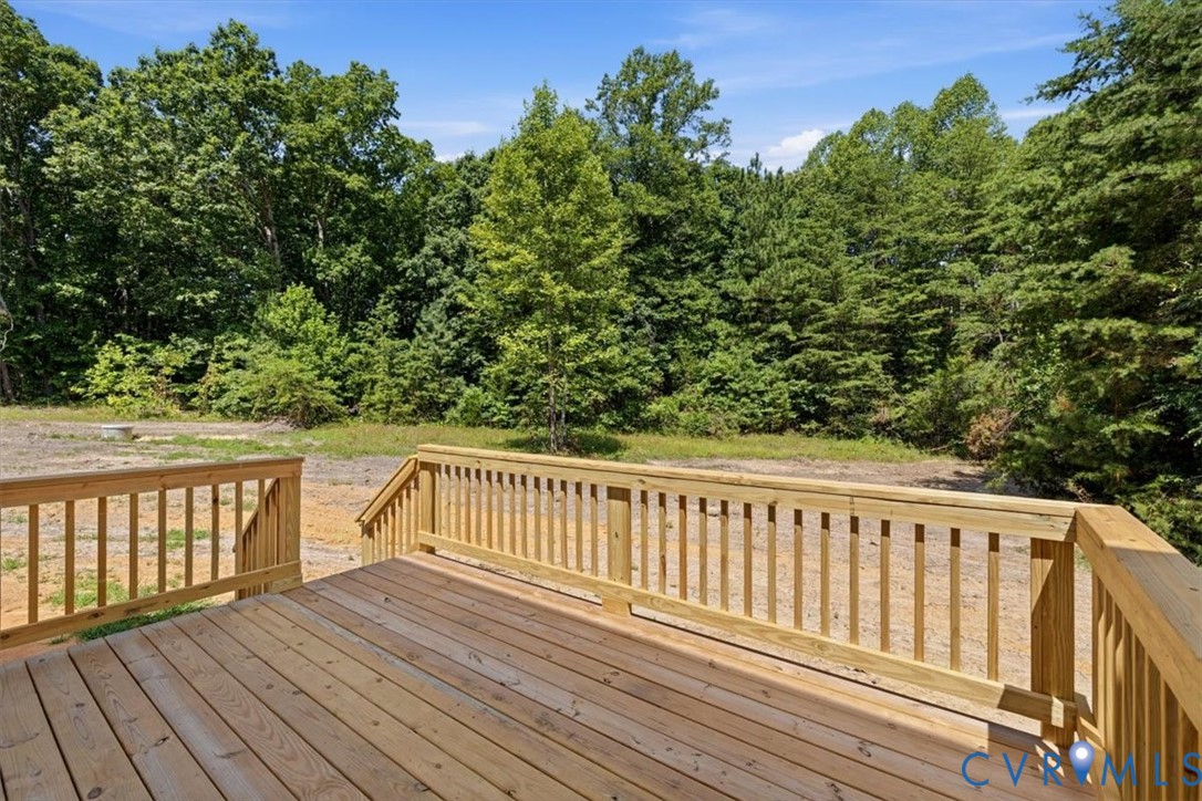 654 Frenchs Store Road Cumberland, VA 23040 - Photo 18 of 24 New wooden deck with railings overlooking a wooded