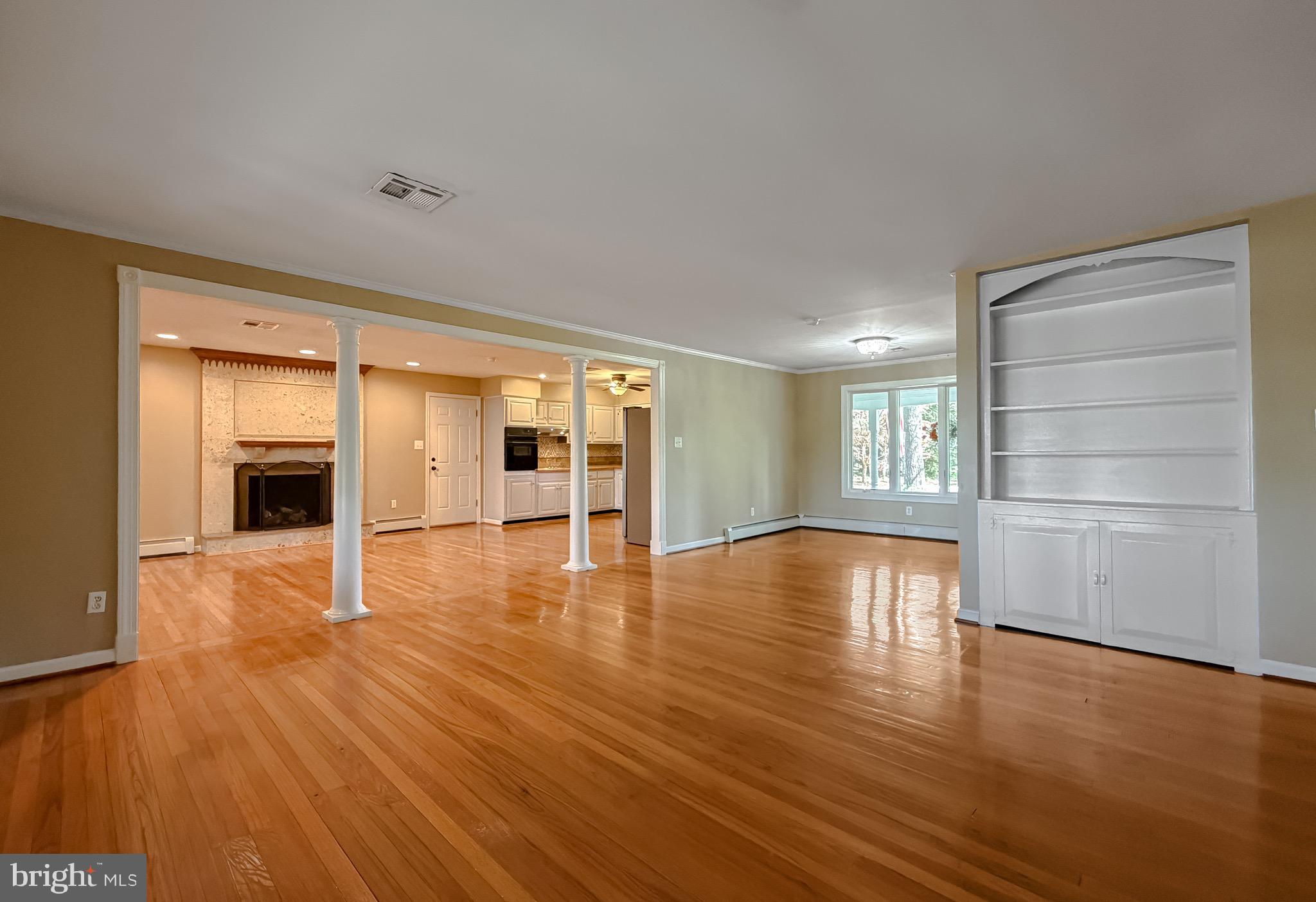19479 North Snow Hill Manor Road Lexington Park, MD 20653 - Photo 34 of 34 a view of empty room with wooden floor and fireplace
