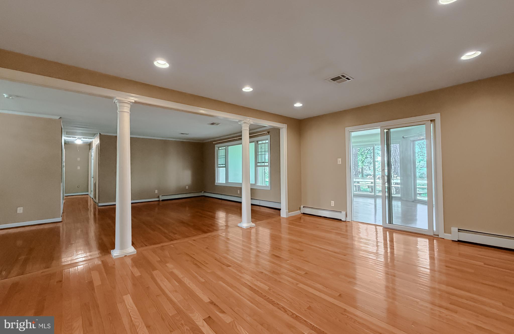 19479 North Snow Hill Manor Road Lexington Park, MD 20653 - Photo 18 of 34 a view of an empty room with wooden floor