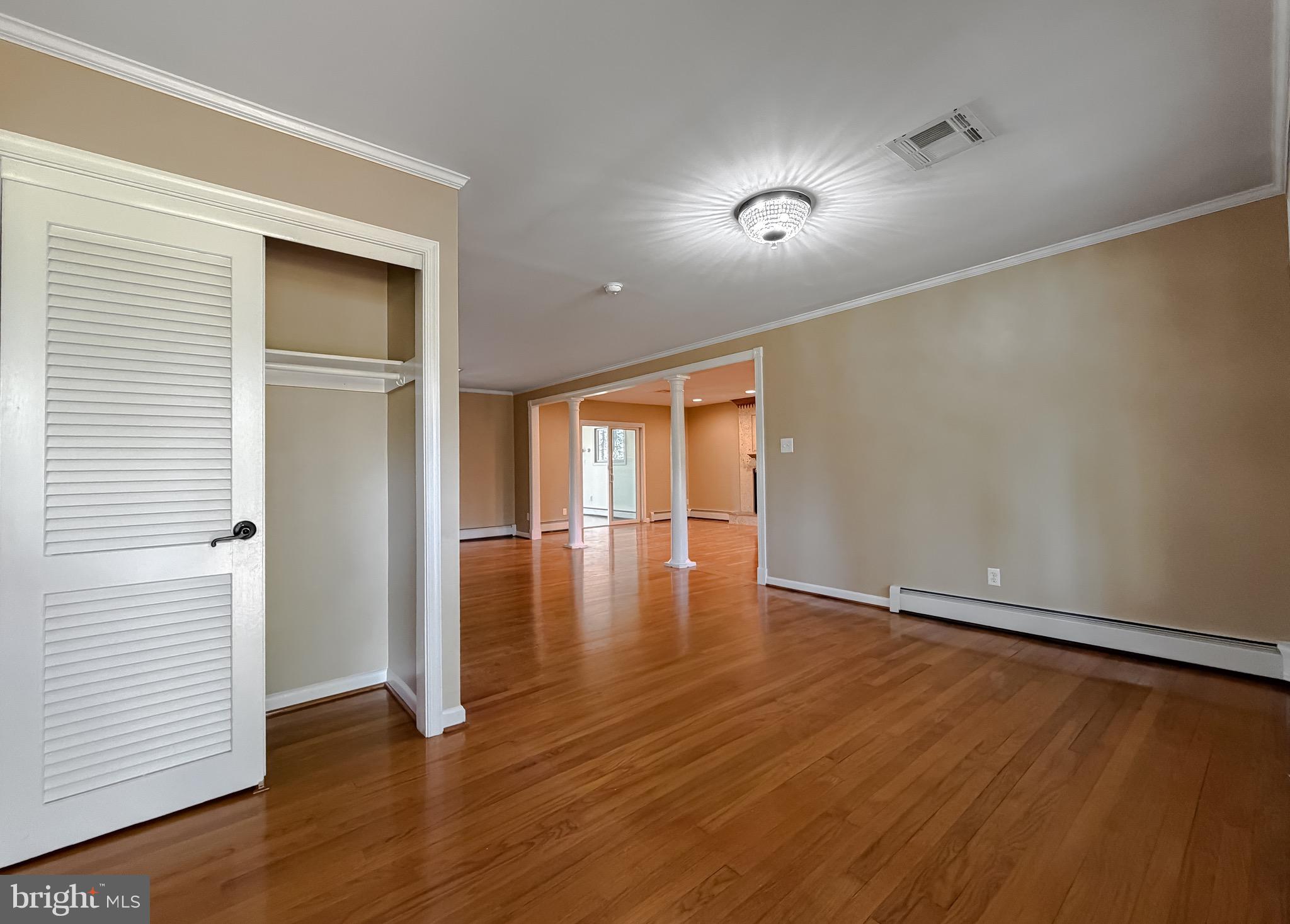 19479 North Snow Hill Manor Road Lexington Park, MD 20653 - Photo 22 of 34 an empty room with wooden floor and closet