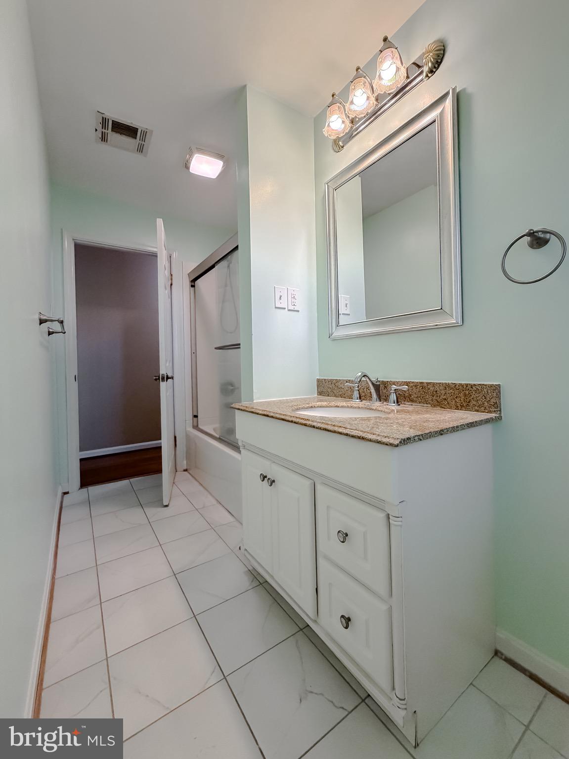 19479 North Snow Hill Manor Road Lexington Park, MD 20653 - Photo 27 of 34 a bathroom with a sink and a mirror