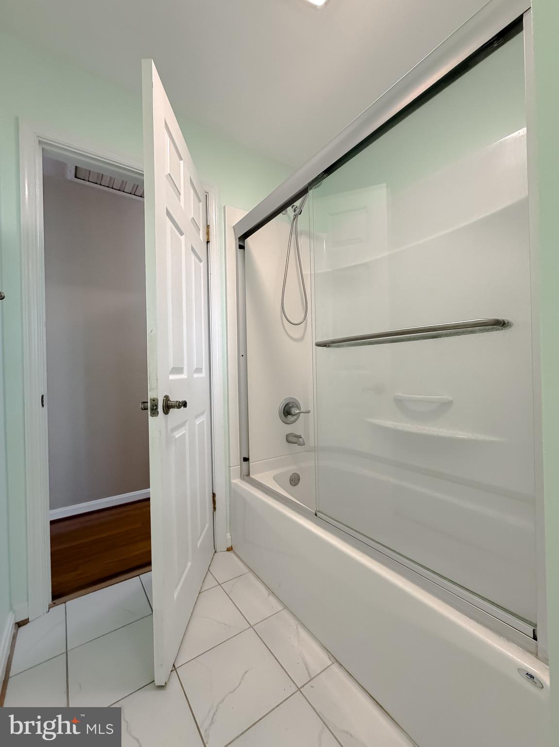 19479 North Snow Hill Manor Road Lexington Park, MD 20653 - Photo 28 of 34 a bathroom with a bathtub and a shower