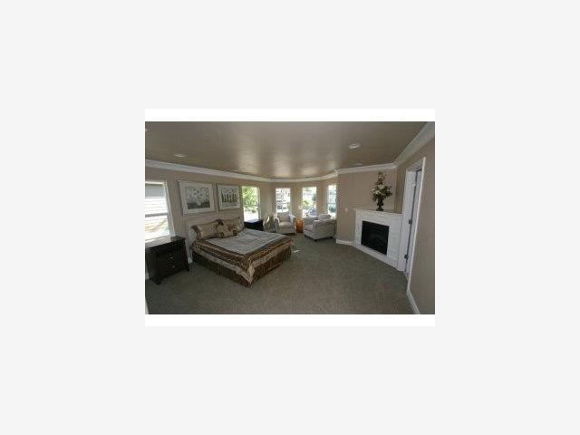 831 Monroe Street Santa Clara, CA 95050 - Photo 8 of 9 a living room with furniture and a fireplace