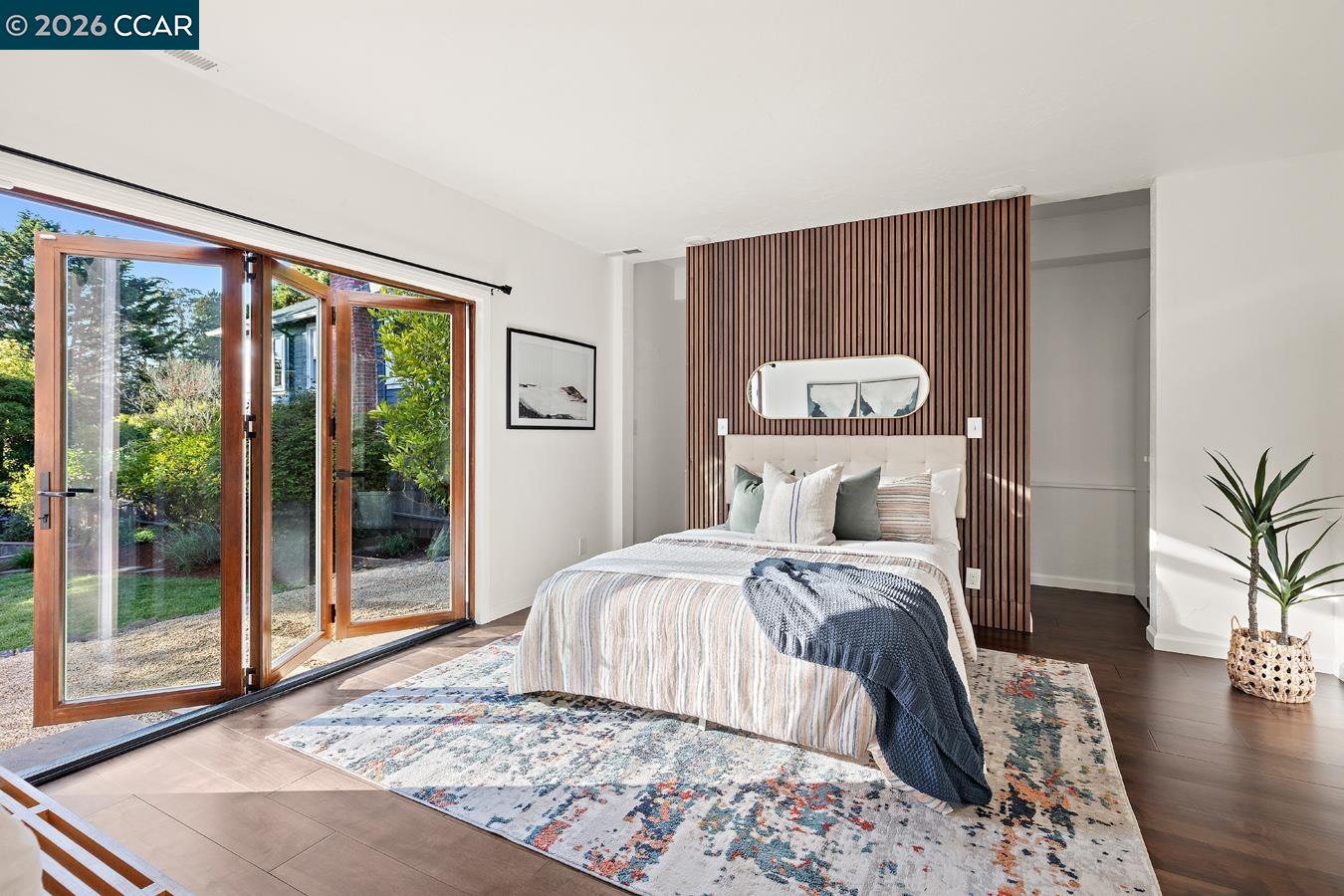 85 Ardmore Road Kensington, CA 94707 - Photo 18 of 45 a bedroom with a large bed and a large window