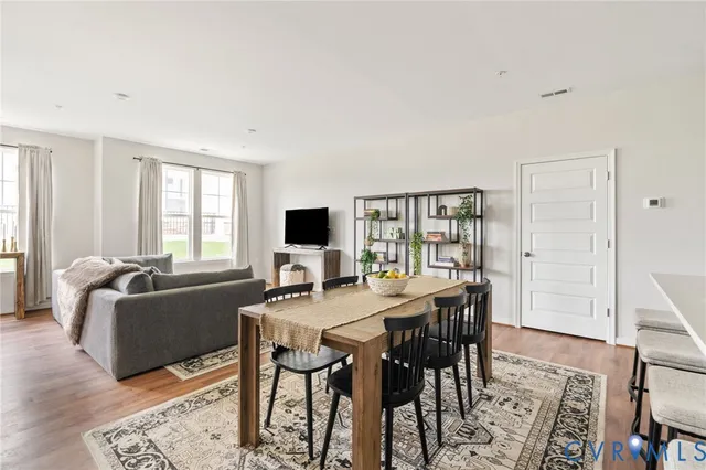 a view of a livingroom with furniture and a window